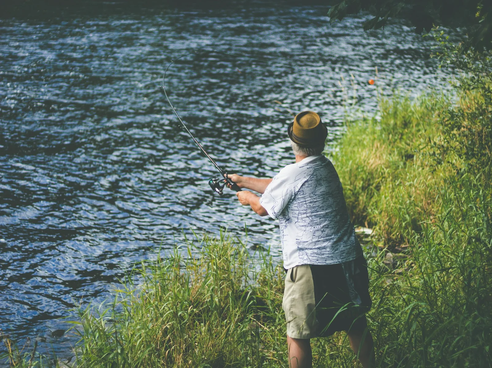 An angler casting into a river